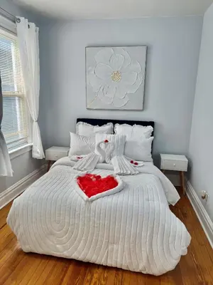 a bedroom with a bed with a large white bedspread at Heaven on earth in Bayonne