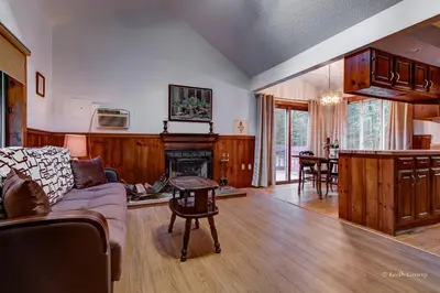 a living room with a couch and a fireplace at Private Cabin Rental with Wood-Burning Fireplace in Canadensis, Pennsylvania in Canadensis