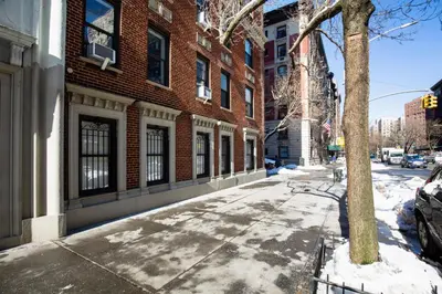 an empty street in front of a brick building at Blueground Bloomingdale fitness center nr Central Park NYC-1869 in New York