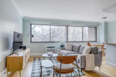 a living room with a couch and a table at Blueground Manhattan Valley fitness nr Central Park NYC-1101 in New York