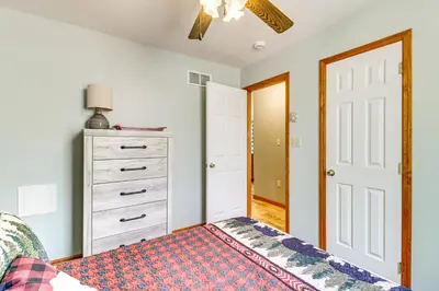 a bedroom with a bed and a dresser at Game Room and Lake Access Albrightsville Escape in Albrightsville