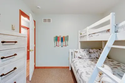 a bedroom with a bunk bed and a ladder at Game Room and Lake Access Albrightsville Escape in Albrightsville