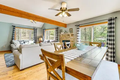 a living room with a table and a couch at Game Room and Lake Access Albrightsville Escape in Albrightsville