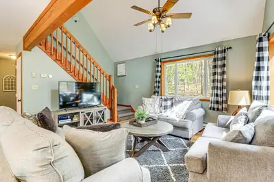 a living room with couches and a flat screen tv at Game Room and Lake Access Albrightsville Escape in Albrightsville
