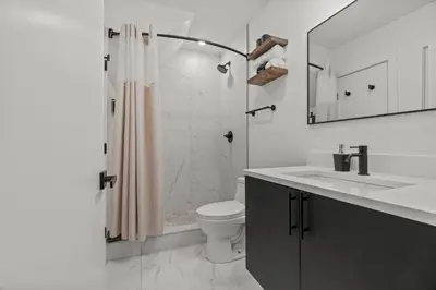 a bathroom with a shower and a toilet and a sink at New townhouse SLEEP 4 Best Spot-Old City Philly in Philadelphia