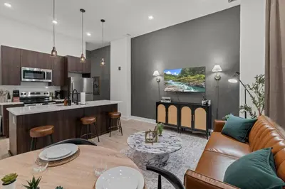 a living room and kitchen with a couch and a table at New townhouse SLEEP 4 Best Spot-Old City Philly in Philadelphia