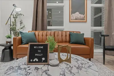 a living room with a couch and a table at New townhouse SLEEP 4 Best Spot-Old City Philly in Philadelphia