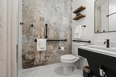 a bathroom with a toilet and a sink at Walk to Everything in Old City- ADA compliant unit in Philadelphia