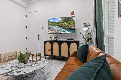 a living room with a couch and a table at Walk to Everything in Old City- ADA compliant unit in Philadelphia