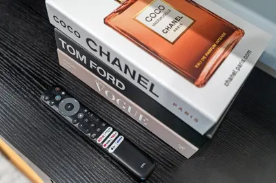 two dvds and a remote control sitting on a table at In The Center of Old City Philly- Walker Paradise! in Philadelphia