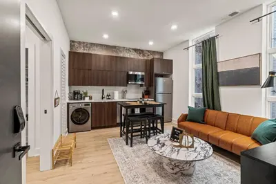 a living room with a couch and a table at In The Center of Old City Philly- Walker Paradise! in Philadelphia