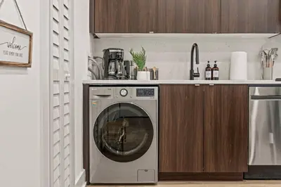 a washing machine in a kitchen with a counter at Old City-New Building Charm-Walk to Everything! in Philadelphia