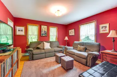 a living room with two couches and a tv at Peaceful Countryside Retreat with Yard in Frenchtown in Frenchtown