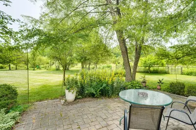 a patio with a table and chairs in a yard at Peaceful Countryside Retreat with Yard in Frenchtown in Frenchtown