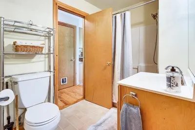a bathroom with a toilet and a sink at Peaceful Countryside Retreat with Yard in Frenchtown in Frenchtown
