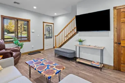 a living room with a large flat screen tv at Long Term Favorite - Skippack Village in Schwenksville