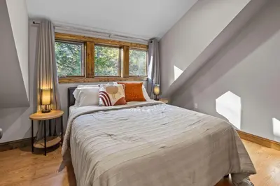 a bedroom with a large bed in a attic at Long Term Favorite - Skippack Village in Schwenksville