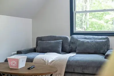 a living room with a couch and a table at The Blakeslee Blue Escape in Blakeslee