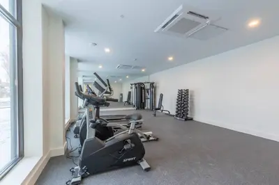 a gym with treadmills and ellipticals in a room at Vibrant Visit 4BR, 4bath, Park 2cars FREE| 20% OFF in East Orange
