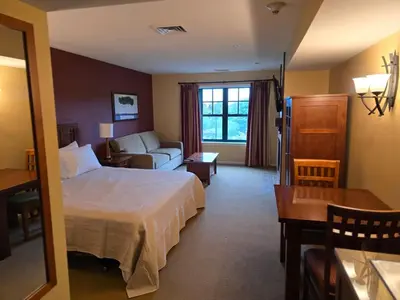 a hotel room with a bed and a couch at The Appalachian Hotel at Mountain Creek Resort - Pool, Hot Tub & Sauna in Vernon Township