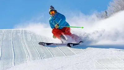 a man is skiing down a snow covered slope at The Appalachian Hotel at Mountain Creek Resort - Pool, Hot Tub & Sauna in Vernon Township