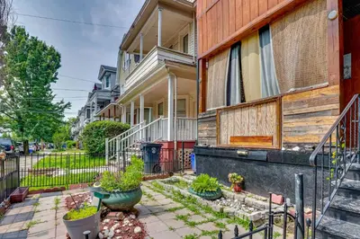 an apartment building with a courtyard with potted plants at 3 Mi to Dtwn Newark Eclectic and Walkable Apt! in Newark