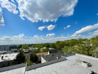 a view from the roof of a building at Sunny Jersey City 1BR, 25 min to NYC, 15min to EWR, King Bed, Hammock & Park Views in Jersey City