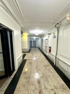 an empty hallway in an office building at Sunny Jersey City 1BR, 25 min to NYC, 15min to EWR, King Bed, Hammock & Park Views in Jersey City