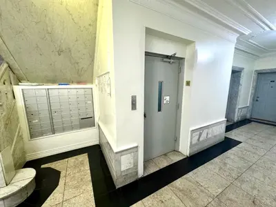 a hallway with a door in a building at Sunny Jersey City 1BR, 25 min to NYC, 15min to EWR, King Bed, Hammock & Park Views in Jersey City