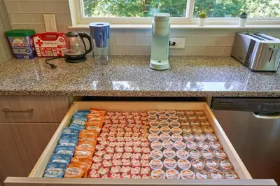 a box of donuts sitting on top of a counter at Cozy Huguenot Hideaway in Huguenot
