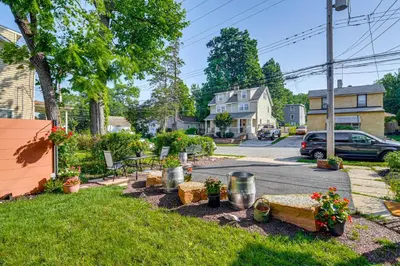 a yard with a table and chairs on a street at Walkable Location, Near PGA Champ! Updated Home