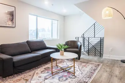 a living room with a couch and a table at 2Bed,Bath&WDWIFICentralToaster in Philadelphia