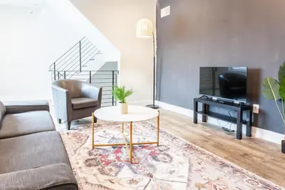 a living room with a couch and a table at 2Bed,Bath&WDWIFICentralToaster in Philadelphia