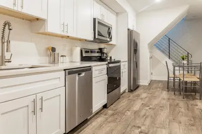 a kitchen with white cabinets and stainless steel appliances at 2-Bed&2-BathWDCentralKitchenWifiDesk in Philadelphia