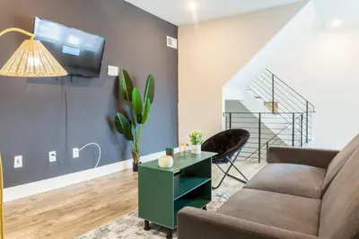 a living room with a couch and a table at 2-Bed&2-BathWDCentralKitchenWifiDesk in Philadelphia