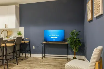 a living room with a computer on a table at 3BR3Bath Home with King Beds Sleeps 8 in Philadelphia