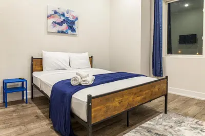 a bedroom with a bed with towels on it at City 3Bed3BAKing Beds,Washer & Dryer,Free Parking in Philadelphia