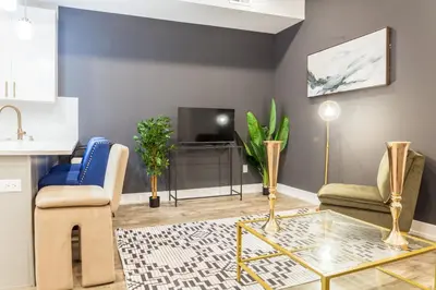 a living room with a table and chairs and a tv at City 3Bed3BAKing Beds,Washer & Dryer,Free Parking in Philadelphia