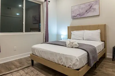 a bedroom with a bed with towels on it at City 3Bed3BAKing Beds,Washer & Dryer,Free Parking in Philadelphia