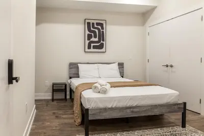 a bedroom with a bed with two towels on it at City 3Bed3BAKing Beds,Washer & Dryer,Free Parking in Philadelphia