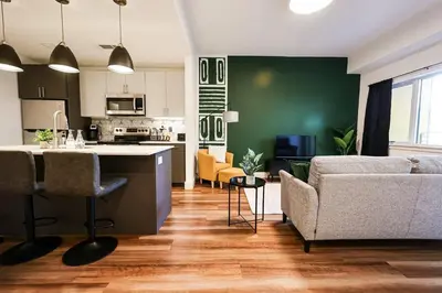 a kitchen and living room with a couch and a table at 1bdrmapartment In The-heartofphiladelphia in Philadelphia