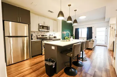 a kitchen with a stainless steel refrigerator and a counter at 1bdrmapartment In The-heartofphiladelphia in Philadelphia