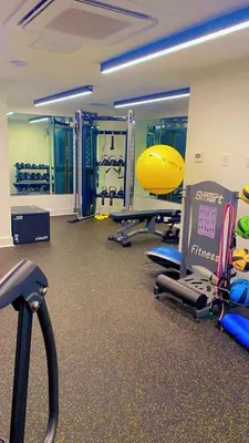 a gym with several treadmills and machines in a room at 1bdrmapartment In The-heartofphiladelphia in Philadelphia