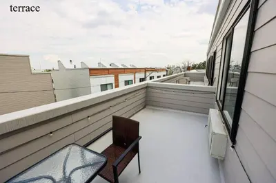 a balcony with a chair and a window at Central 1BR1BAKing BedWiFiWD in Philadelphia