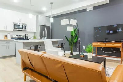 a living room with a couch and a table at 3Bed3BathWDDeskWiFiHeating in Philadelphia