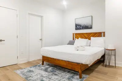 a bedroom with a bed with a teddy bear on it at 3Bed3BathWDDeskWiFiHeating in Philadelphia