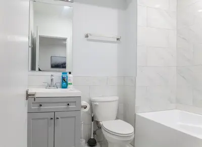 a white bathroom with a toilet and a sink at 3Bed3BathWDDeskWiFiHeating in Philadelphia