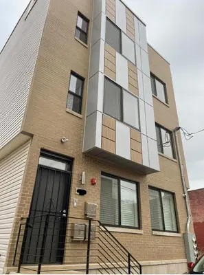a tall brick building with windows on a street at 3Bed3BathWDDeskWiFiHeating in Philadelphia