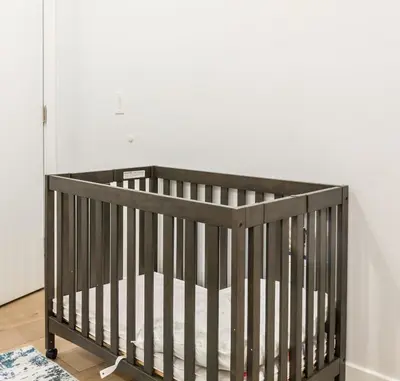 a crib in a room with a white wall at 3Bed3BathWDDeskWiFiHeating in Philadelphia
