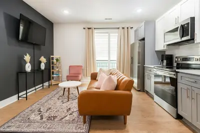 a living room with a couch and a table at 1Bed1Bath-CentralKingBed,WD,WIFI in Philadelphia